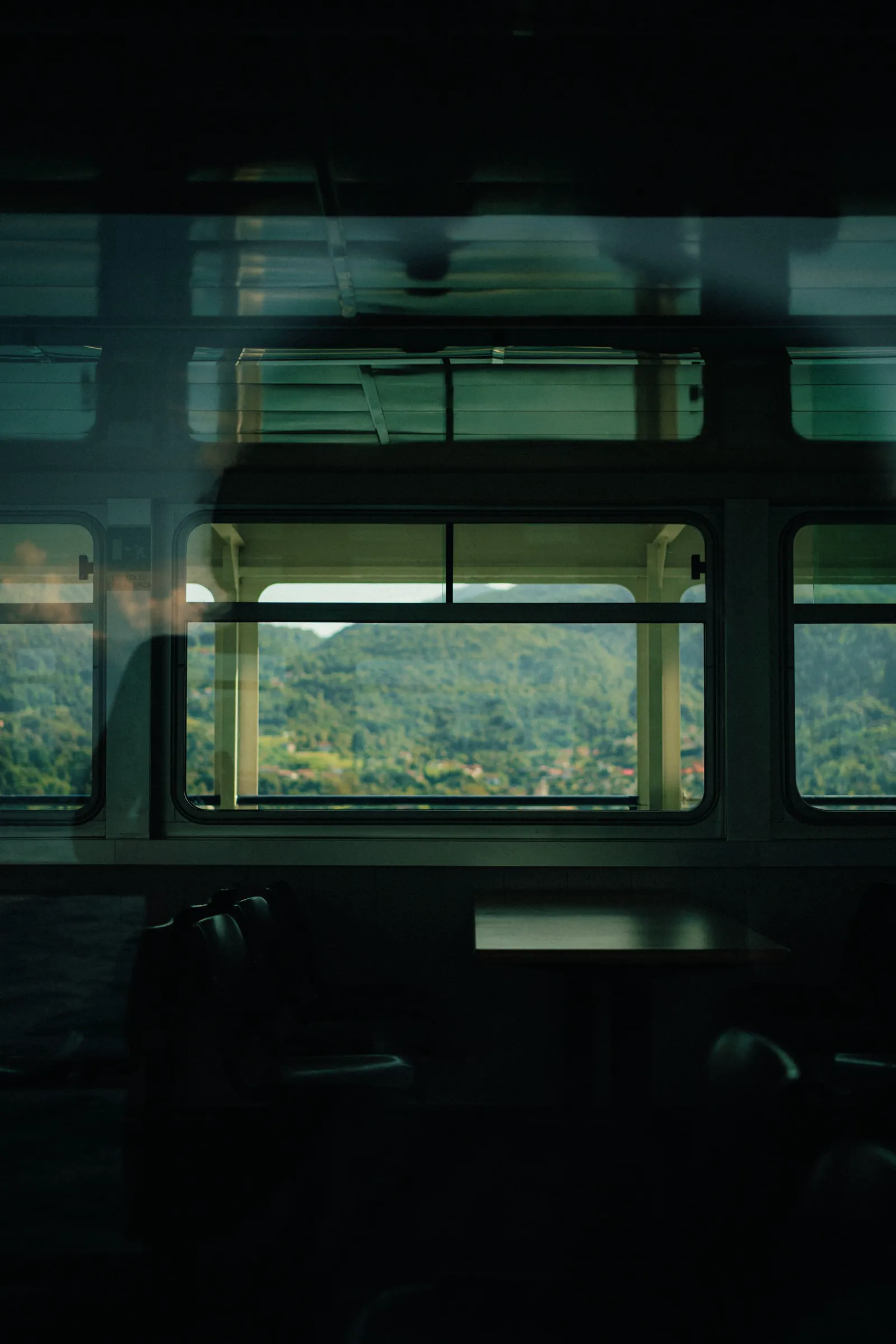 A quiet view through a train window in Italy